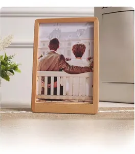 Detail of natural beech wood photo frame showcasing smooth grain and creative tabletop design