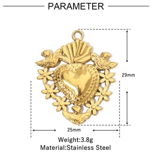 Detail of vintage heart pendant in gold stainless steel with intricate floral carvings