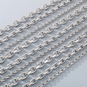 Macro shot of silver stainless steel chain links showing texture and metallic finish