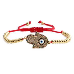 Bracelet cordon rouge Hamsa et Œil Mauvais avec perles dorées et charmes en zircon