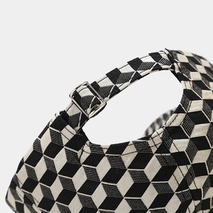 Detail of baseball cap back with 3D geometric pattern and silver metal buckle