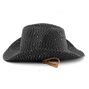 Detail of black straw cowboy hat featuring gold and white speckles and brown woven cord