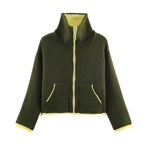 Detail of olive green knit jacket featuring neon yellow contrast piping and zipper