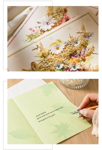 Detailed view of handmade greeting card with dried flowers and elegant handwritten text