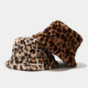 Close-up of leopard print faux fur bucket hats showing soft plush texture for winter