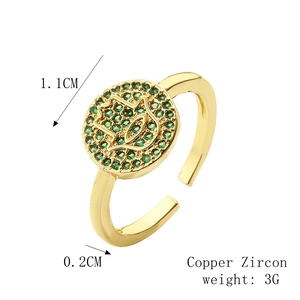 Macro detail of Hamsa Hand ring in 18K gold plated copper with green zircon stones