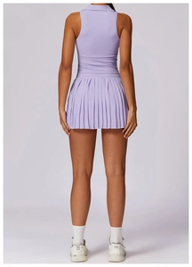 Rear view of lavender sleeveless polo top and high waisted pleated skirt sports set