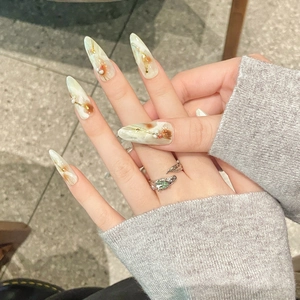 Handmade Chinese style press-on nails with amber marble, gold foil and pearl accents
