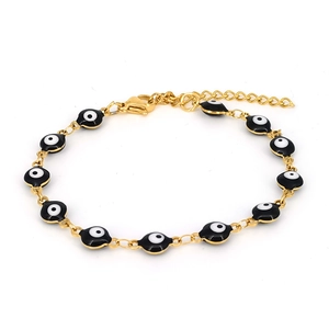 Detail of golden Evil Eye bracelet featuring ten black enamel beads on a delicate chain