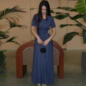 Detail of slim fit dark blue maxi dress featuring a U-neckline and high waist design