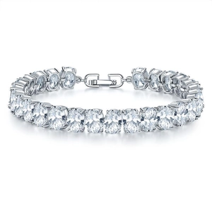 Detail of silver oval rhinestone bracelet with secure metal clasp on white background