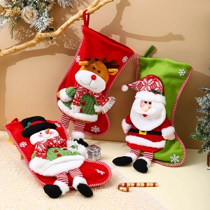 Three 3D plush Christmas stockings with Santa, Reindeer and Snowman for holiday gifts