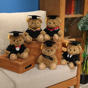Five graduation teddy bears in black caps and gowns with congratulations sashes