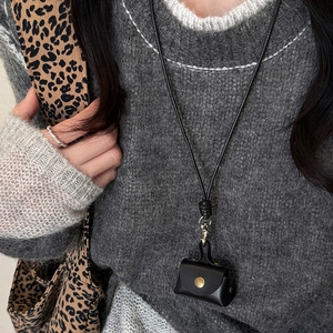 Minimalist black leather mini neck pouch for earphones with a stylish woven lanyard