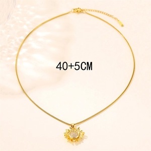 Elegant gold sunflower necklace with zircon center on beige background, length 40+5cm