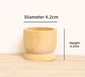 Detail view of a natural wooden egg holder base with dimensions 4.2CM diameter and 3.2CM height
