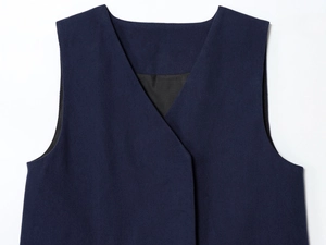 Detailed close-up of navy blue V-neck vest vest with premium twill fabric texture
