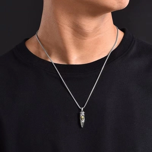 Men's retro bullet pendant necklace with gold skull detail on silver-tone chain