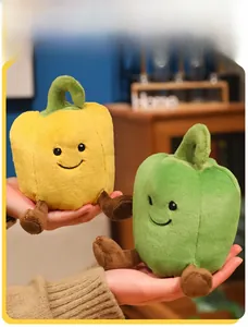 Close-up of yellow and green bell pepper plush toys with embroidery detail and soft texture