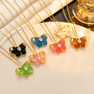 Macro view of butterfly pendant necklace collection in seven colors with heart zircon