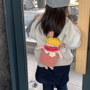 Pink handmade crochet child crossbody bag featuring a cute character with yellow hair