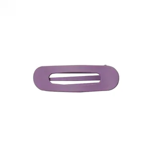 Macro detail of purple matte oval hollow hair clip with a minimalist frosted finish