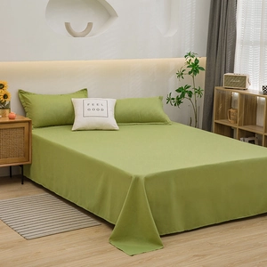 Minimalist grass green washed cotton bedding set with sheets and 'Feel Good' pillowcase
