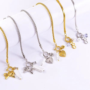 Stainless steel bracelet set featuring bow pendants, pearls, and square crystals in silver and gold
