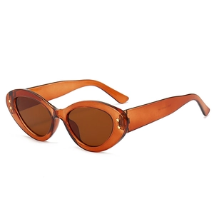 Retro amber oval sunglasses with star metal rivets and orange frames for women