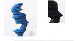 Detail of modern abstract face sculptures with matte texture in blue and black colors