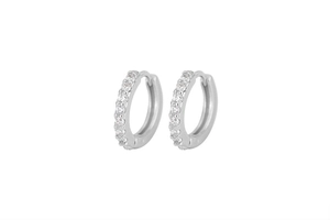 Close-up of elegant S925 sterling silver hoop earrings with sparkling zircon inlay