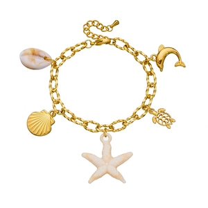 Golden ocean theme chain bracelet with starfish turtle and dolphin charms on white background