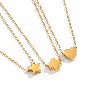 Gold stainless steel necklaces featuring heart, star, and cross pendants on white backdrop