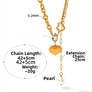 Detail showing heart pendant, pearl and zircon on mixed stainless steel chain necklace