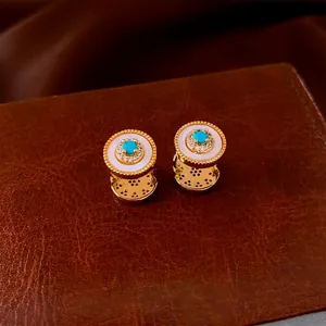 Vintage style gold plated sunburst hoop earrings with turquoise and zircon stones