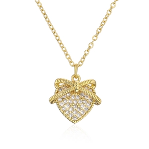 Gold bow heart pendant necklace with shimmering zircon stones on a sleek chain