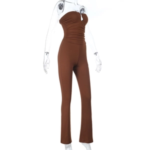 Detailed side view of brown strapless jumpsuit featuring waist pleats and slim fit