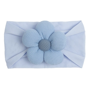 Detail of baby light blue nylon elastic headband with 3D knitted flower decoration