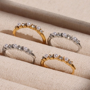Elegant adjustable ring set with white pearls and sparkling cubic zirconia in gold and silver