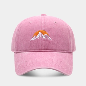 Pink washed cotton baseball cap featuring minimalist sunrise mountain embroidery pattern