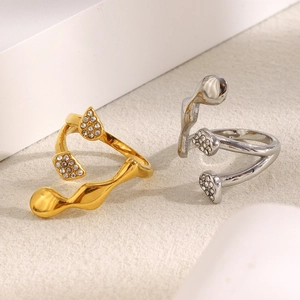 Modern abstract 18K gold and silver open rings with minimalist crystal accents