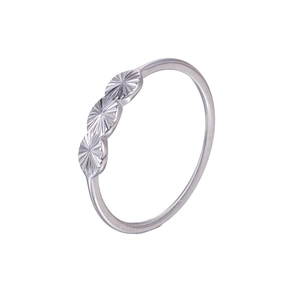 Detailed view of silver minimalist ring featuring three oval textured sunburst engravings