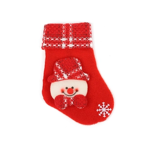 Red Christmas stocking with snowman decor and red plaid cuff on white background