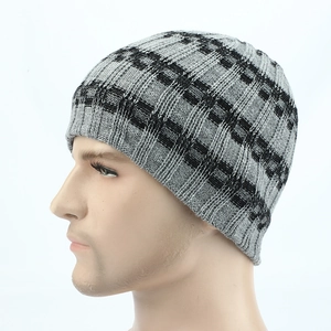 Close-up of grey and black checkered knit beanie with vertical rib texture on a mannequin