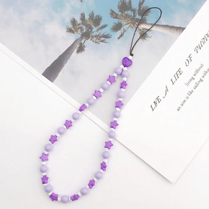 Detail of purple beaded phone strap with acrylic stars, hearts and round beads