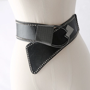 Detail of a black punk wide corset belt with silver rivets and a large metal ring buckle