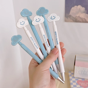Close-up of cute cloud-topped retractable gel pens in blue and white colors
