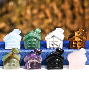 Set of eight miniature hand-carved natural crystal houses in diverse mixed gemstones