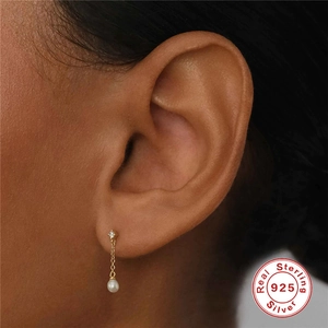 Elegant 925 sterling silver tassel earrings featuring white pearls and diamond accents