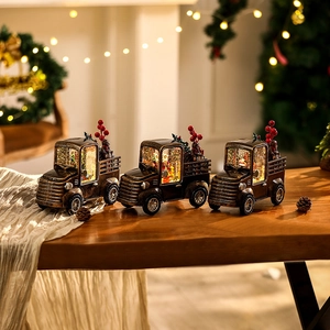 Vintage bronze Christmas truck music box with Santa scenes and glowing LED lights
